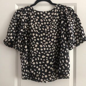 Flowy crop top with bow detail on back